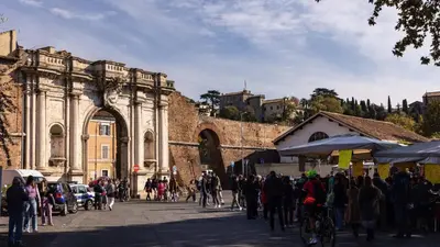 a group of people standing in front of a building at Dave's Home In Trastevere in Rome