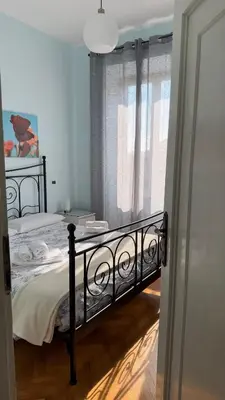 a bedroom with a bed and a window at ColleVaticano Roma in Rome