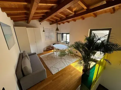 a living room with a couch and a table at Casa indipendente con vista acquedotto romano in Rome