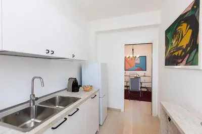 a kitchen with a sink and a counter top at Amazing Ponte Milvio in Rome