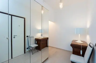 a room with a desk and a chair and a mirror at Amazing Ponte Milvio in Rome