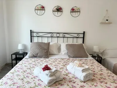 a bedroom with a bed with two towels on it at Dreams in Rome St Peter s - Near Vaticano in Rome