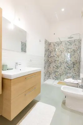 a bathroom with a sink and a toilet and a shower at Trieste Guesthouse - ZENO 48 in Rome