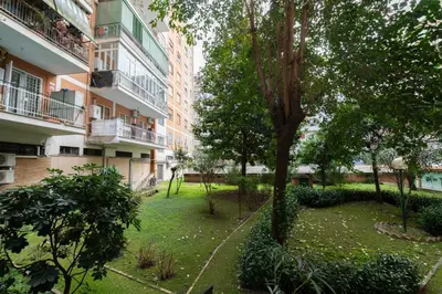 a garden in the middle of a building at Al settimo cielo RomaPigneto in Rome
