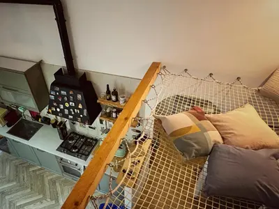 a kitchen with a stove and a couch in a room at Rome Like Home in Rome