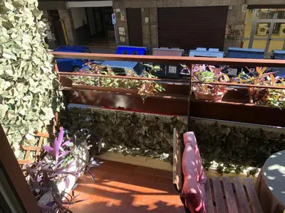 a balcony with a bunch of potted plants at Caos Calmo House in Rome