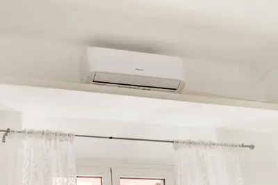 a white shelf with a heater and a window at Casa a San Giovanni - Charming Flat in Rome in Rome