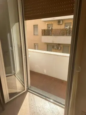 an open window with a view of a balcony at 4venti house in Rome