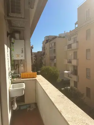 a balcony with a toilet on the side of a building at 4venti house in Rome