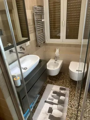 a bathroom with a sink and a toilet at 4venti house in Rome