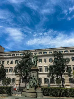 a statue in front of a large building at Rome Is Home in Rome