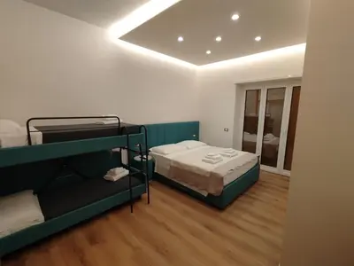 a room with two bunk beds and a window at Charlie Up! in Rome