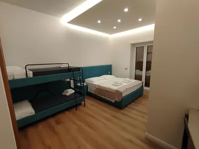 a small room with a bed and a mirror at Charlie Up! in Rome