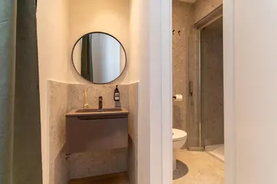a bathroom with a sink and a mirror at Cunabu Urbano V in Rome