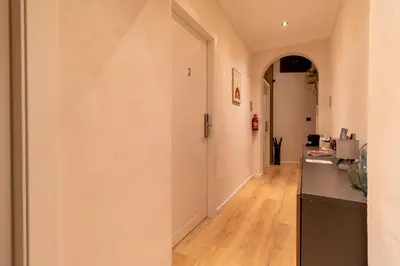 a hallway with a door leading into a room at Cunabu Urbano V in Rome