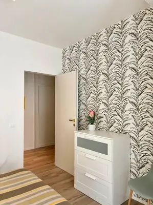 a bedroom with a bed and a wall mural at Green House Rome in Rome