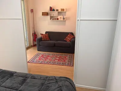 a view of a living room with a couch at Monolocale nuova costruzione con giardino in Rome