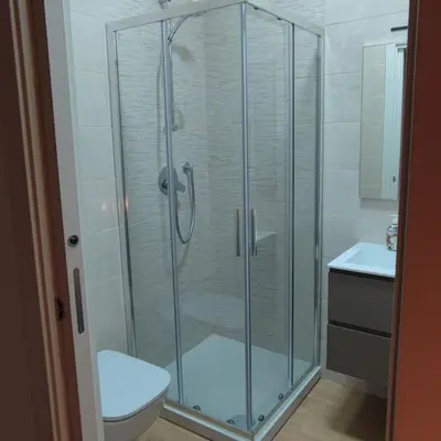 a bathroom with a shower with a toilet and a sink at Monolocale nuova costruzione con giardino in Rome