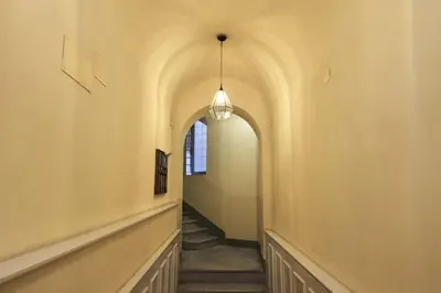an alley way with a hallway with a pendant light at Panoramic Quirinal Penthouse in Rome