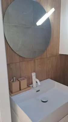a bathroom with a sink and a mirror at LUXURY Amazing Appia Antica - CELIO in Rome