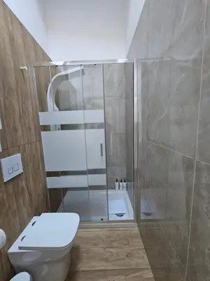 a bathroom with a shower and a toilet at LUXURY Amazing Appia Antica - CELIO in Rome