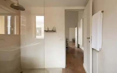 a glass shower in a bathroom with a hallway at Roma magica in Rome
