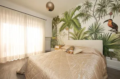 a bedroom with a bed with a teddy bear on it at La casa di Ele in Rome
