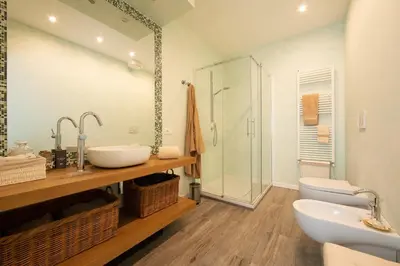 a bathroom with a sink and a toilet and a shower at La casa di Ele in Rome