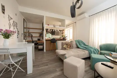 a living room with a couch and a table at La casa di Ele in Rome