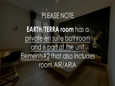 a room with a wall with the wordsianetera room has a private ear suite at Elements in Rome