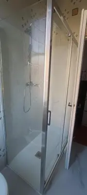 a shower with a glass door in a bathroom at Attico Aventino in Rome
