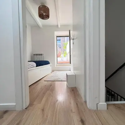 a white room with a bed and a window at Testaccio Terrace,Perfect for families or small groups in Rome