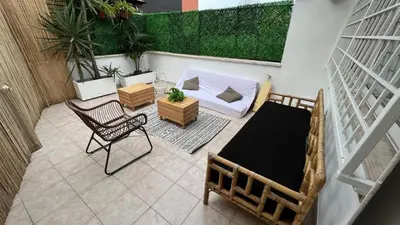 an aerial view of a patio with a chair and a couch at Testaccio Terrace,Perfect for families or small groups in Rome