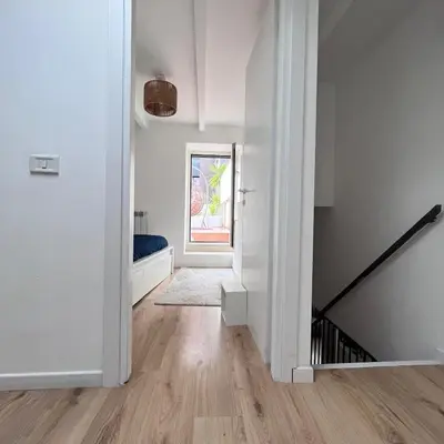 an empty hallway with a door leading to a bedroom at Testaccio Terrace,Perfect for families or small groups in Rome
