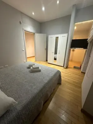 a bedroom with a bed with two towels on it at Cerri apartment in Rome