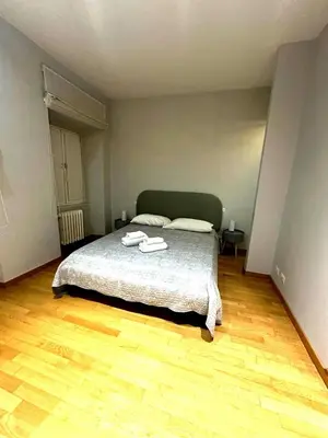 a bedroom with a bed with two towels on it at Cerri apartment in Rome