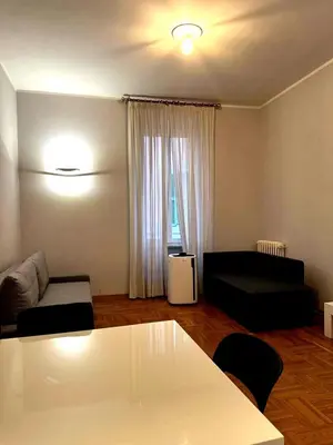 a living room with a couch and a table at Cerri apartment in Rome