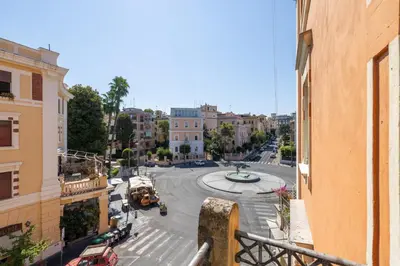 a view of a street in a city with buildings at Piazza Caprera - Family Apartment in Rome