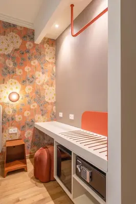 a childs room with floral wallpaper at UNICO Suite - GRUPPO BLAM in Rome