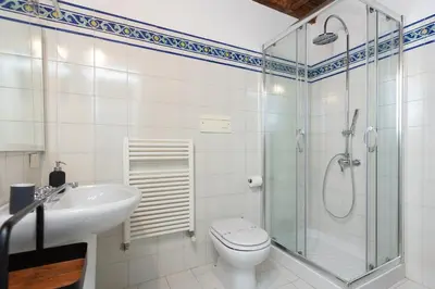 a bathroom with a shower and a toilet and a sink at Santa Margherita by Rental in Rome in Rome