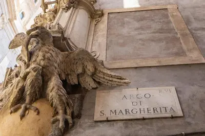 a statue of an angel on the side of a building at Santa Margherita by Rental in Rome in Rome