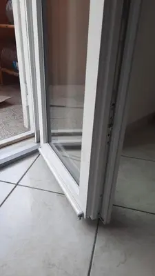a sliding glass door in a room with a floor at Urban Welcome Metro Battistini in Rome