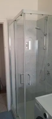 a shower with a glass door in a bathroom at Urban Welcome Metro Battistini in Rome