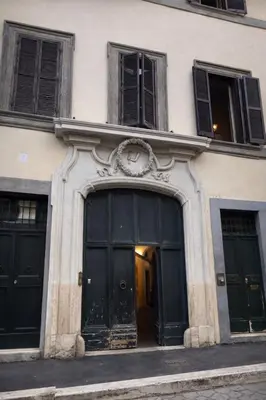 a door with a vase next to a curtain at Veronica Suite, Historic Centre Piazza Venezia in Rome