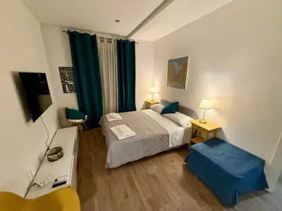 a small bedroom with a bed and a table and chair at Rosetta Lovely House - Pantheon - Roma in Rome