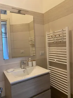a bathroom with a sink and a mirror at Testaccio Charme Apt in Rome