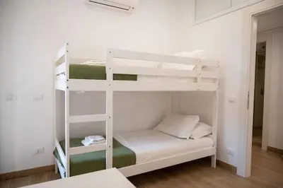 a bedroom with two bunk beds in a room at Fiqus in Rome