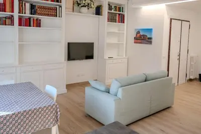 a living room with a couch and a table at Fiqus in Rome