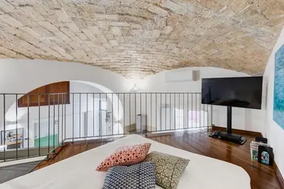 a bedroom with a large bed with a stone ceiling at Casa Valentina - Oasi di tranquillità e stile a Testaccio in Rome