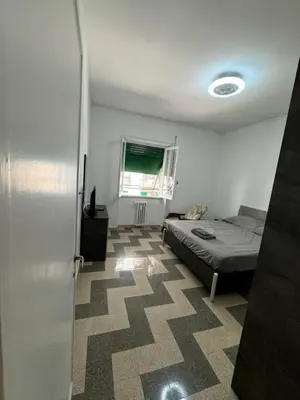 a small bedroom with a bed and a window at Silihome, Trastevere, Piazza della Radio in Rome